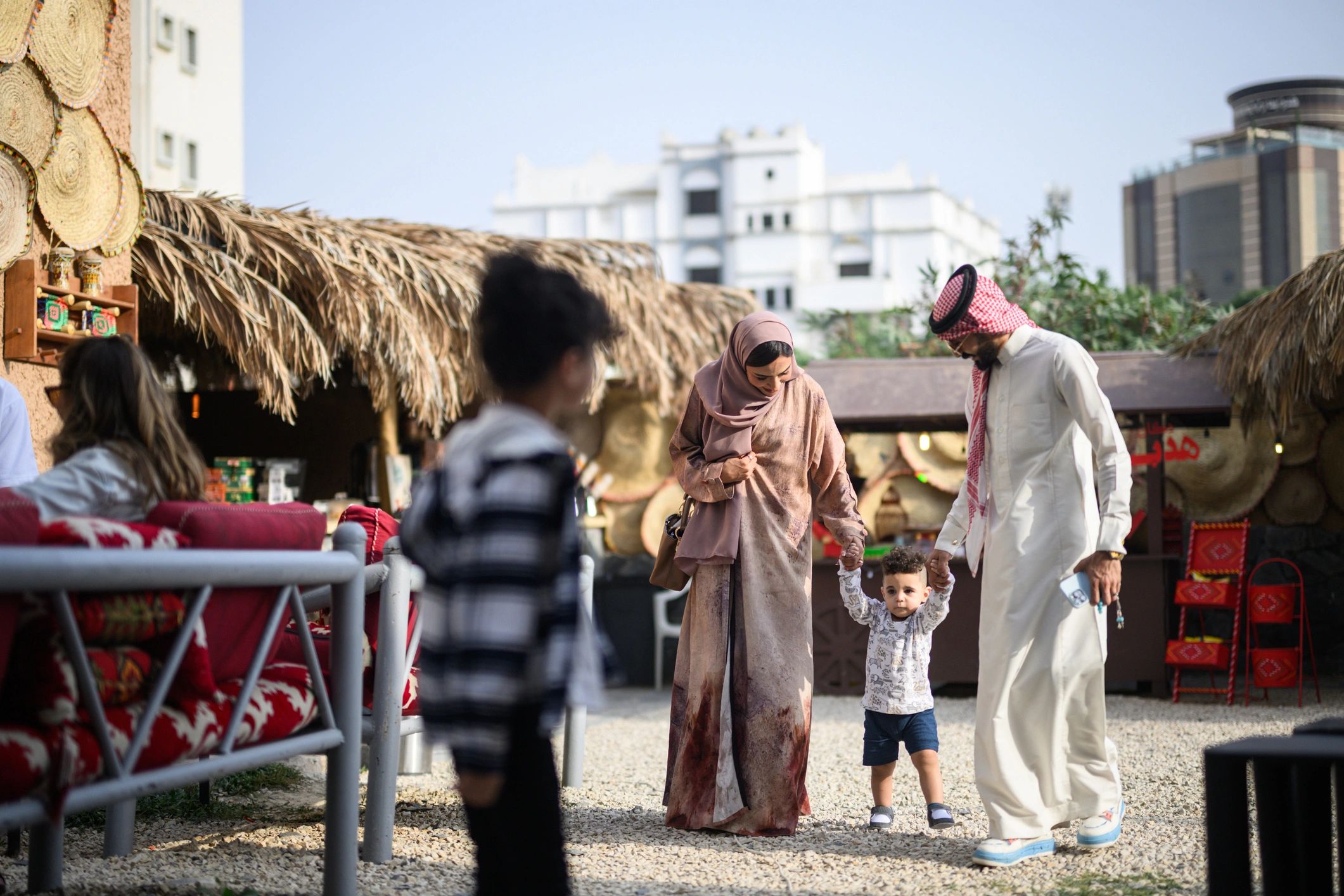 Family walking on vacation, exploring a cultural site